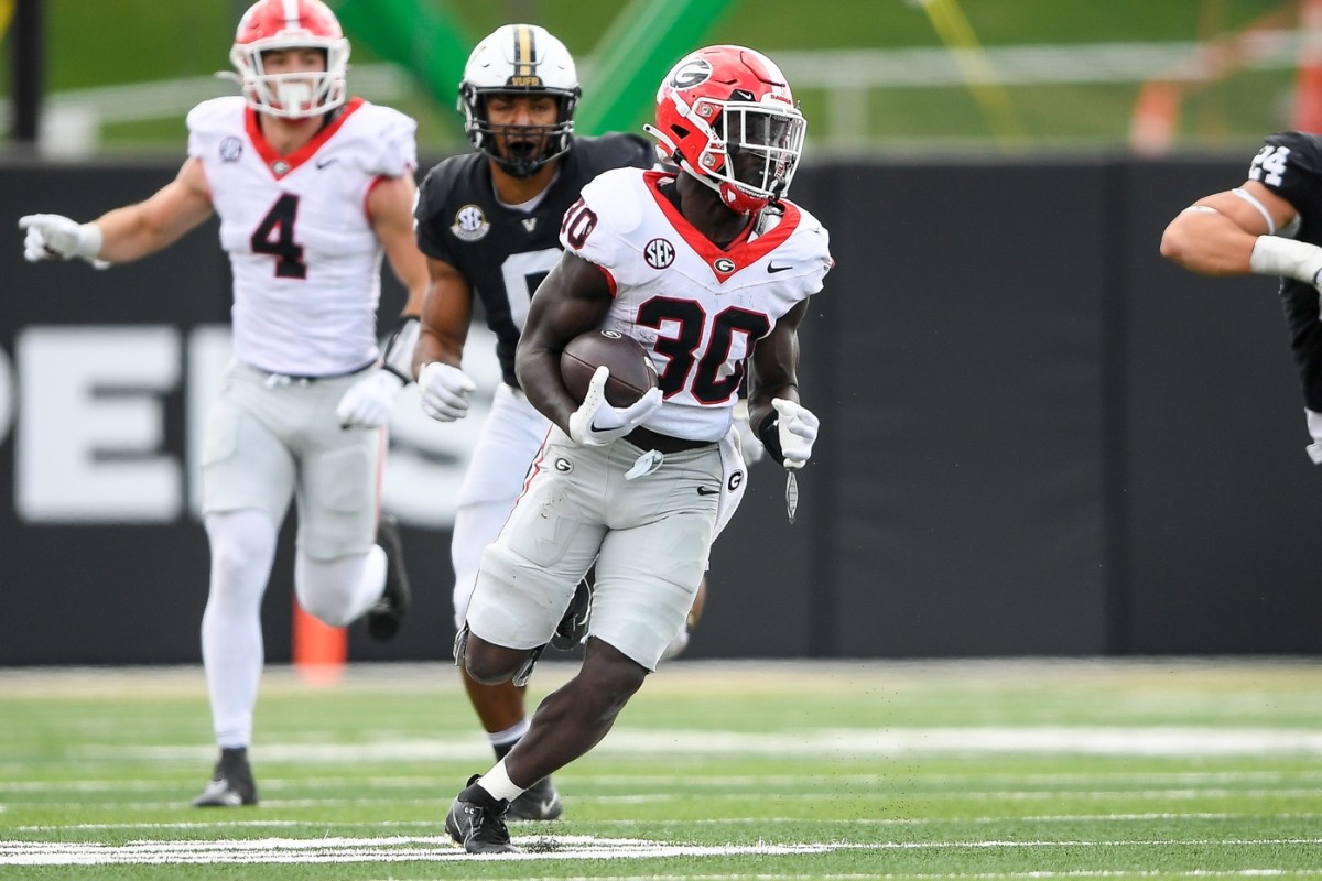 Oct 14, 2023; Nashville, Tennessee, USA; Georgia Bulldogs running back Daijun Edwards (30) runs the ball against the Vanderbilt Commodores during the second half at FirstBank Stadium. 